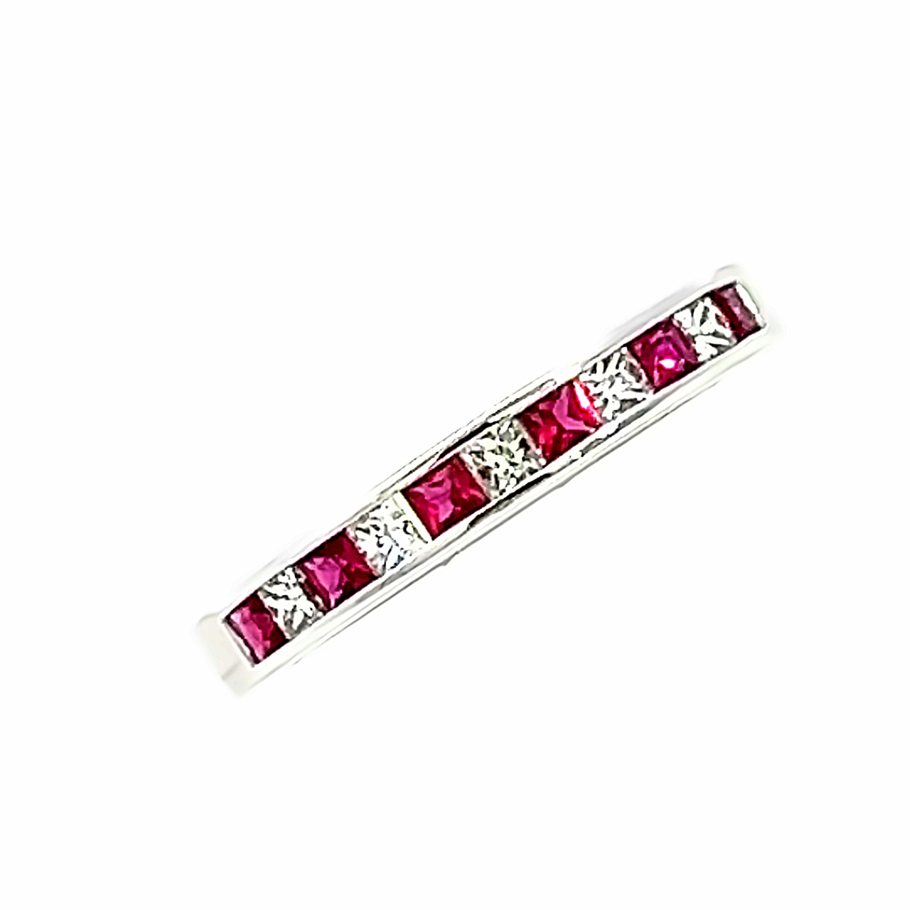 An 18 Carat White Gold, Ruby and Diamond ½ Eternity Ring