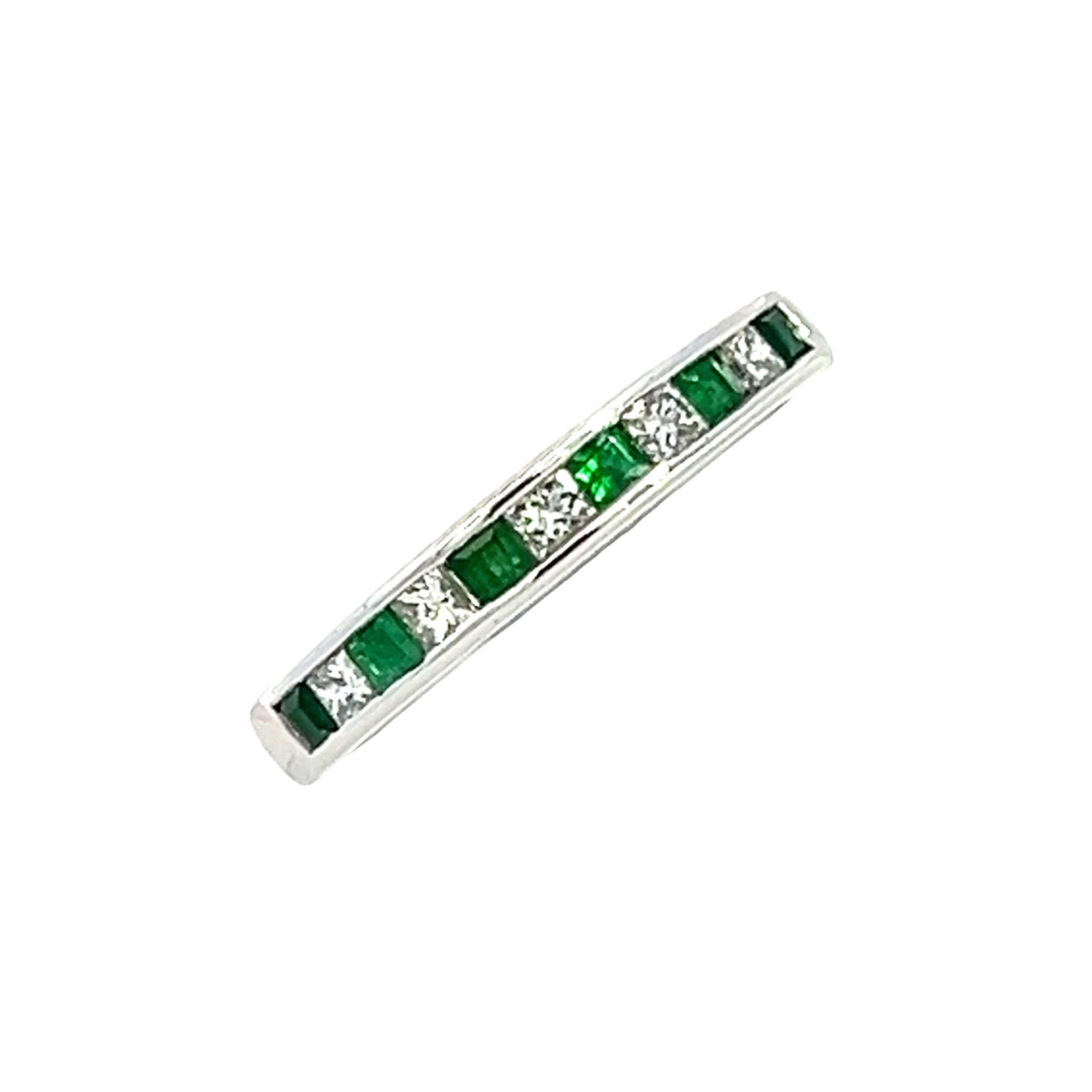 An 18 Carat White Gold, Emerald and Diamond  1/2 Eternity Ring