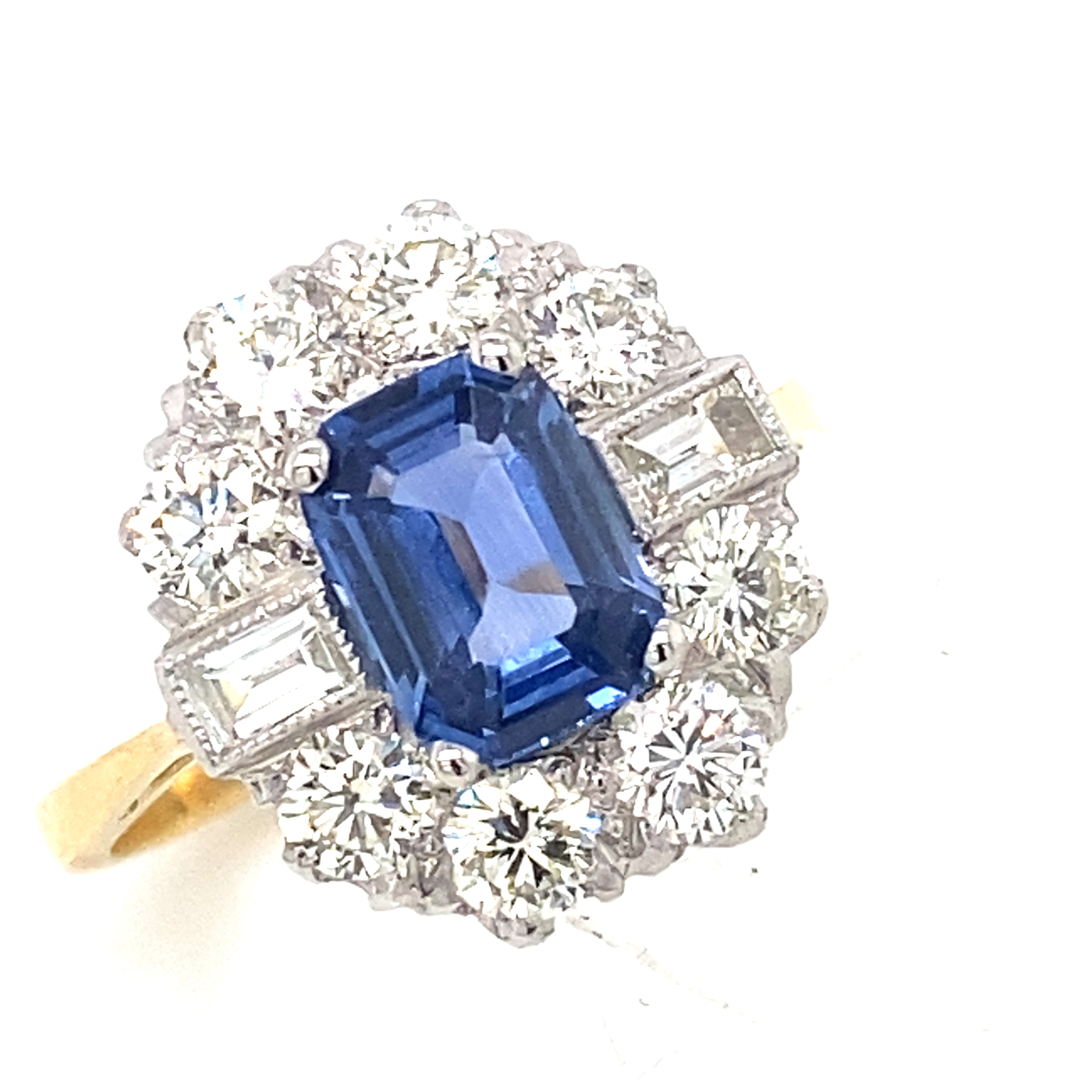 An 18 Carat Yellow and White Gold Sapphire and Diamond Cluster