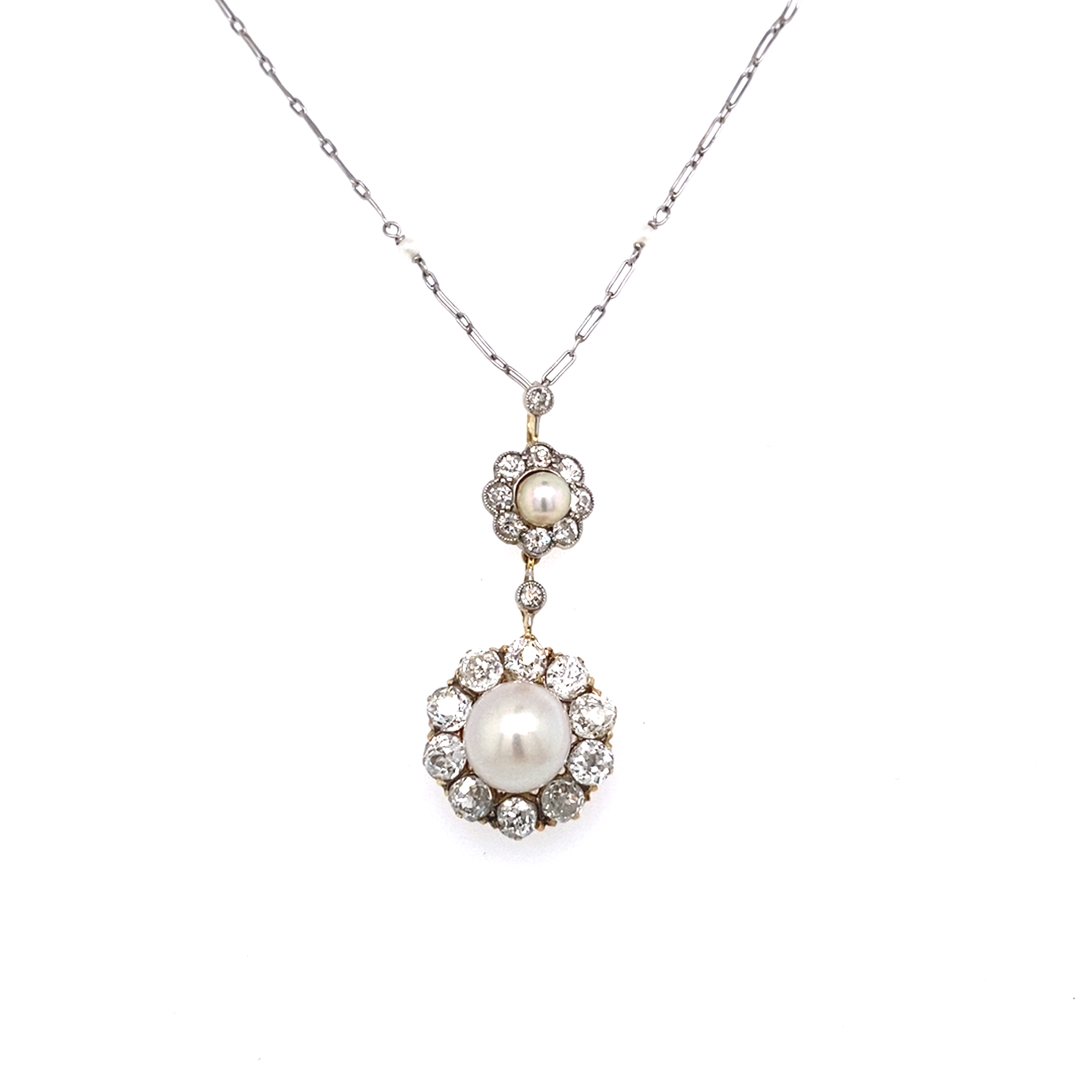 Natural Pearl and Diamond Double Cluster Drop Pendant. Ca. 1910