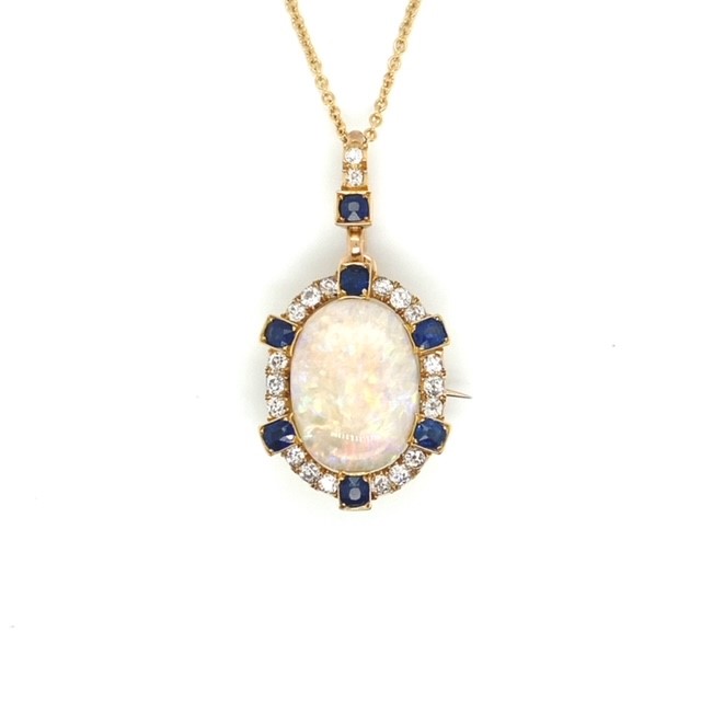 A yellow gold Opal pendant featuring Diamonds and Sapphire