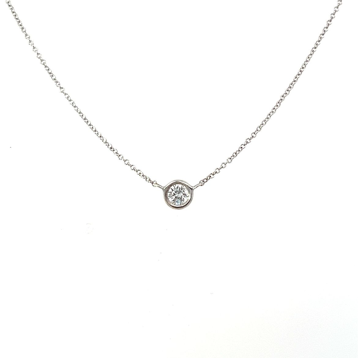 A modern round brilliant 0.45ct diamond pendant