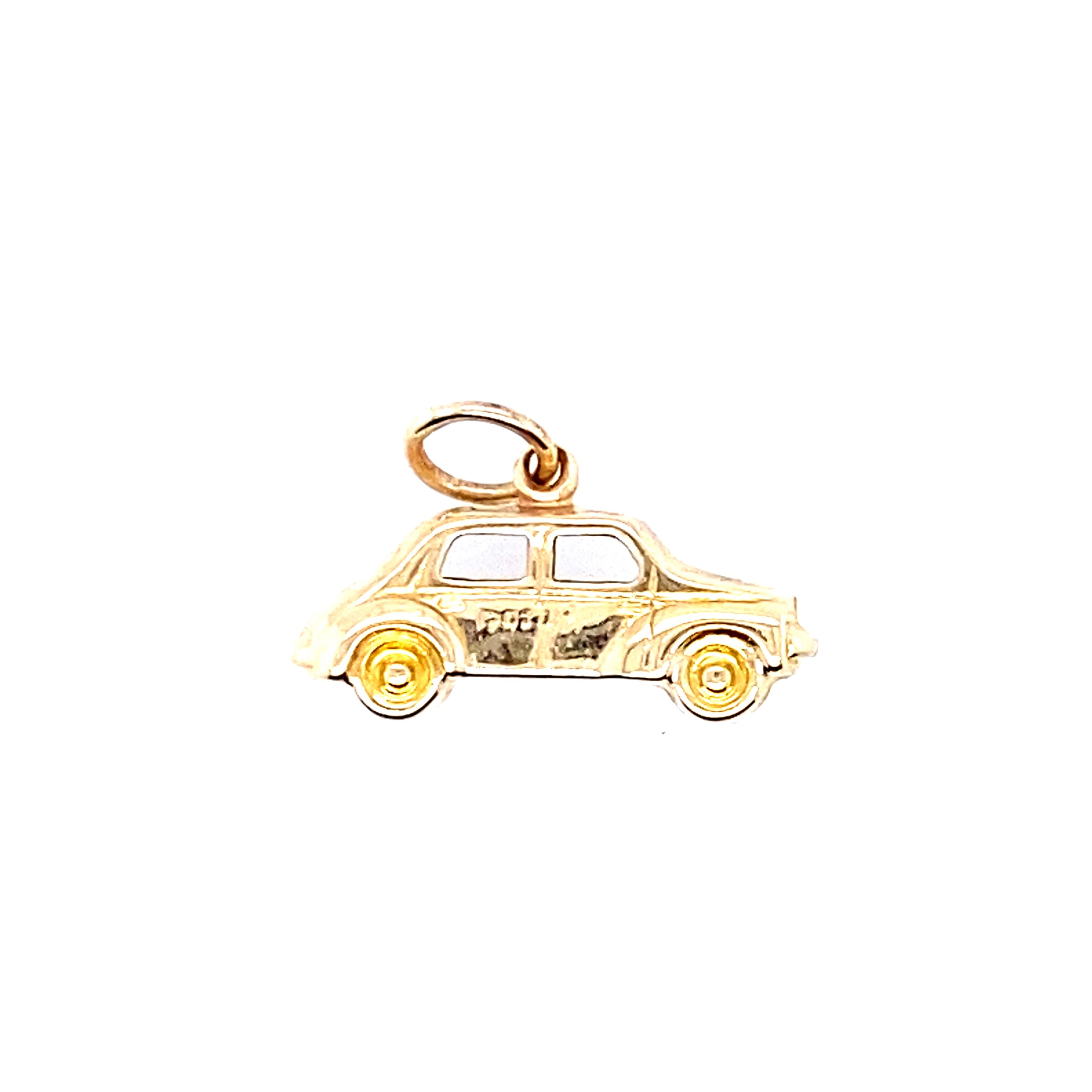 A yellow gold car charm