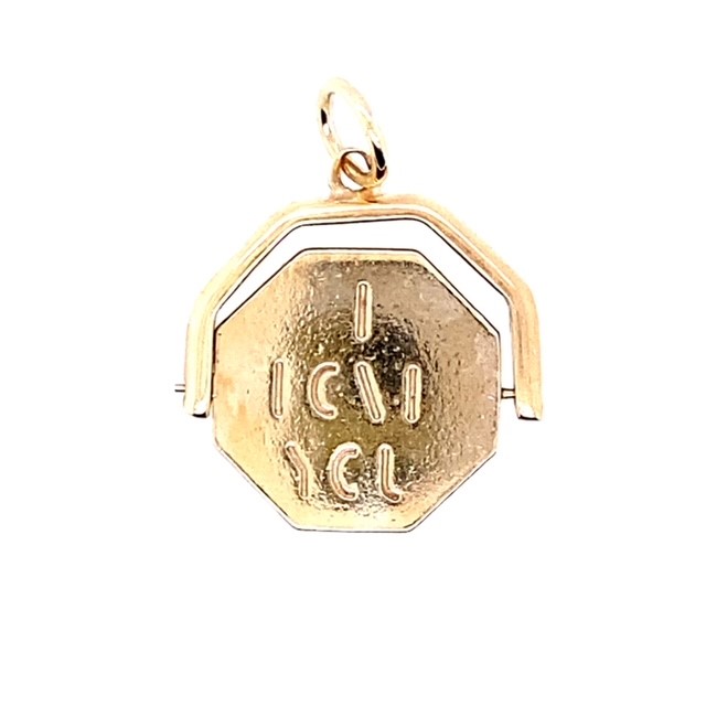 A 9ct yellow gold charm featuring a spinning 'I love you' disc