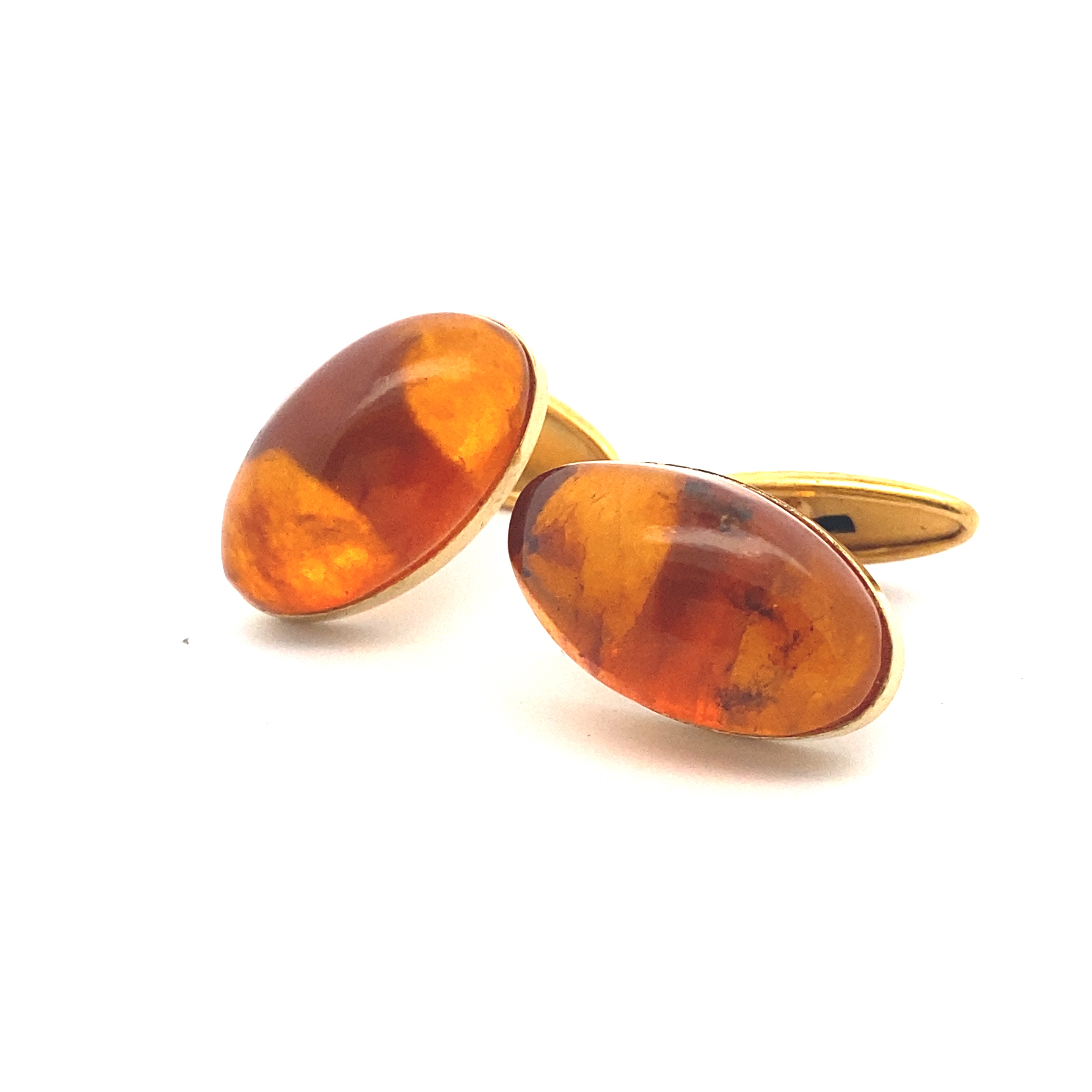 A pair of yellow gold and amber cufflinks