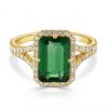 Emerald cut emerald and diamond split shank ring